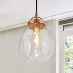 1-Light Dark Gold Kitchen Pendant Light, Modern Hanging Light with Oval Clear Glass Shade for Dining Room by Zevni