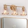 Connty 22 in. Modern 3-Light Gold Vanity Light Transitional Wall Sconce with Clear Glass Shades for Bathroom by Zevni